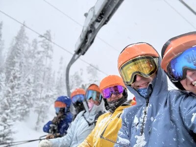 Nelnet associates riding the ski lift at the Jane-A-Thon fundraiser, March 6.
