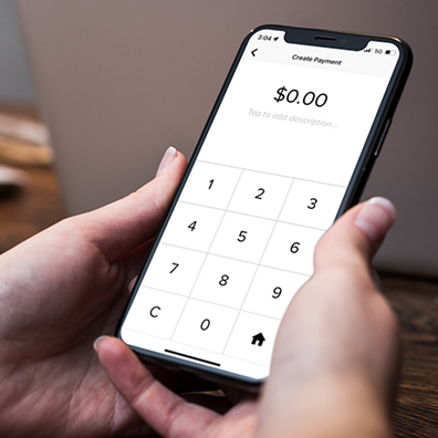 somebody making a payment using their smartphone
