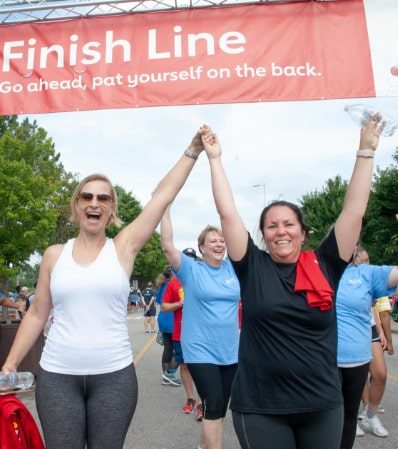Participants celebrate a previous walk. This year's Virtual Heart Walk will focus on staying safe while social distancing.